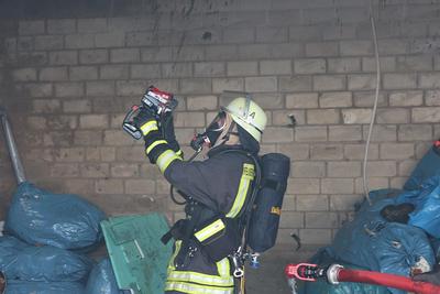 Professional using thermal imaging camera during property inspection